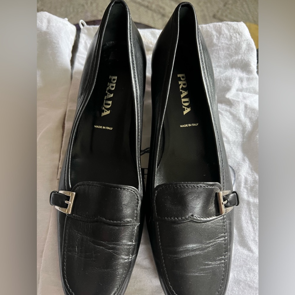 AUTHENTIC Black leather Prada flats with short heel; worn once; with dust bags